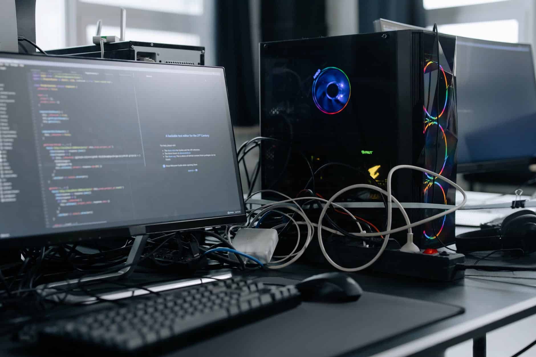 black computer monitor and keyboard